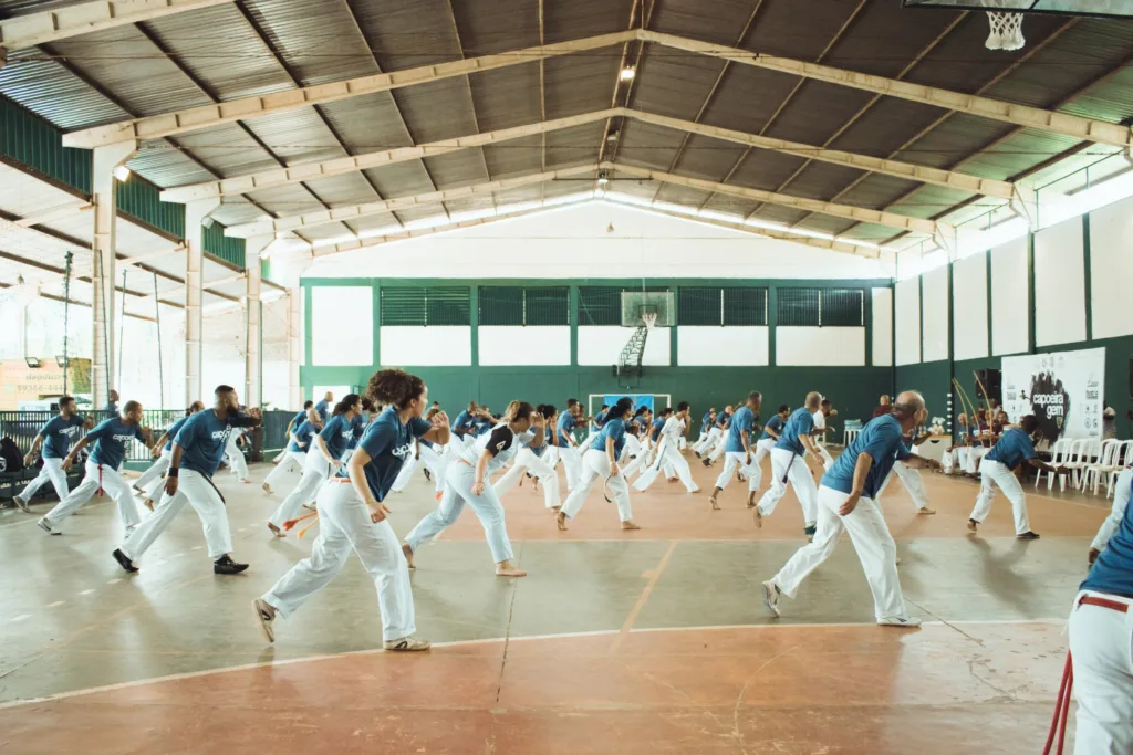 A group of individuals practicing karate in a dojo. They perform synchronized movements and strikes under the guidance of an instructor, highlighting the discipline, coordination, and unity fostered by group karate practice. 
A group of older adults engaging in a fitness class together. They are participating in low-impact exercises that promote flexibility and strength, showcasing the importance of physical activity for maintaining health and well-being in the senior years. 
elderly workout